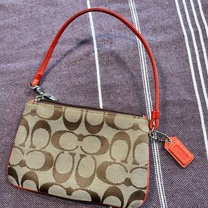 Used COACH Wristlet Orange and Monogram